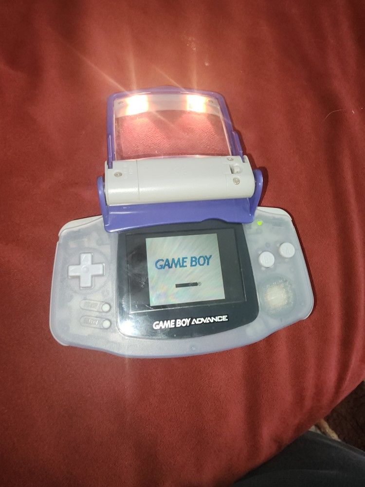 gameboy advance has light and magnifier attachment and case is very rare