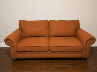 Burnt Orange / Rust Loveseat with Nailhead Trim