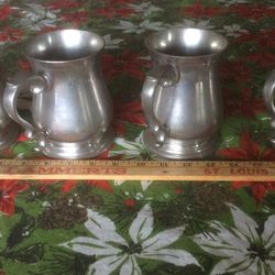 4 pewter Mugs. 50 Years Old. Holds One Pint.