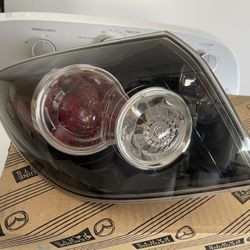2004 - 2009 Mazda speed 3 hatchback rear driver outer tail light