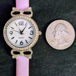 ladies women's mother of pearl face watch with rhinestones pink watch band and a new battery $5