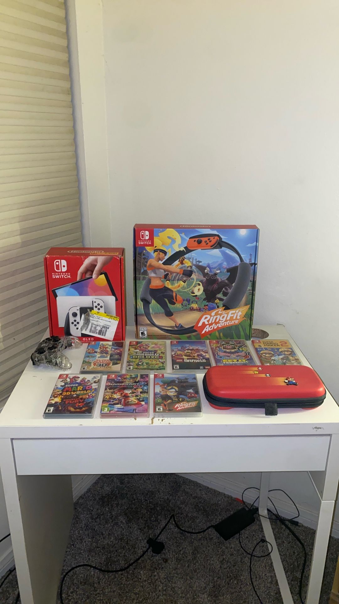 Used Nintendo Switch OLED With 7 Games, One Pro Controller, Ring Fit Adventure Set, And One Switch Case