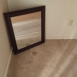 Brown framed mirror 