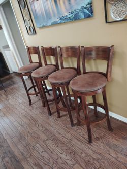 Four beautiful swivel high stool chairs