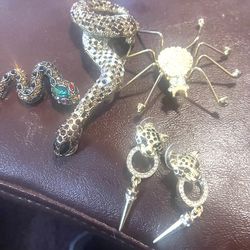 3 pins and a pair of earrings animals