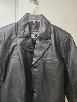 This is a vintage Rigo Sportswear black leather jacket in a men's size small.