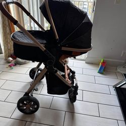 Black and rose gold baby stroller