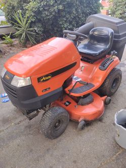 Riding mower with double bag attachment