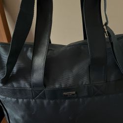 It’s Very Good Duffle Bag Made By GORGIO Armani. The Color Is Teal.