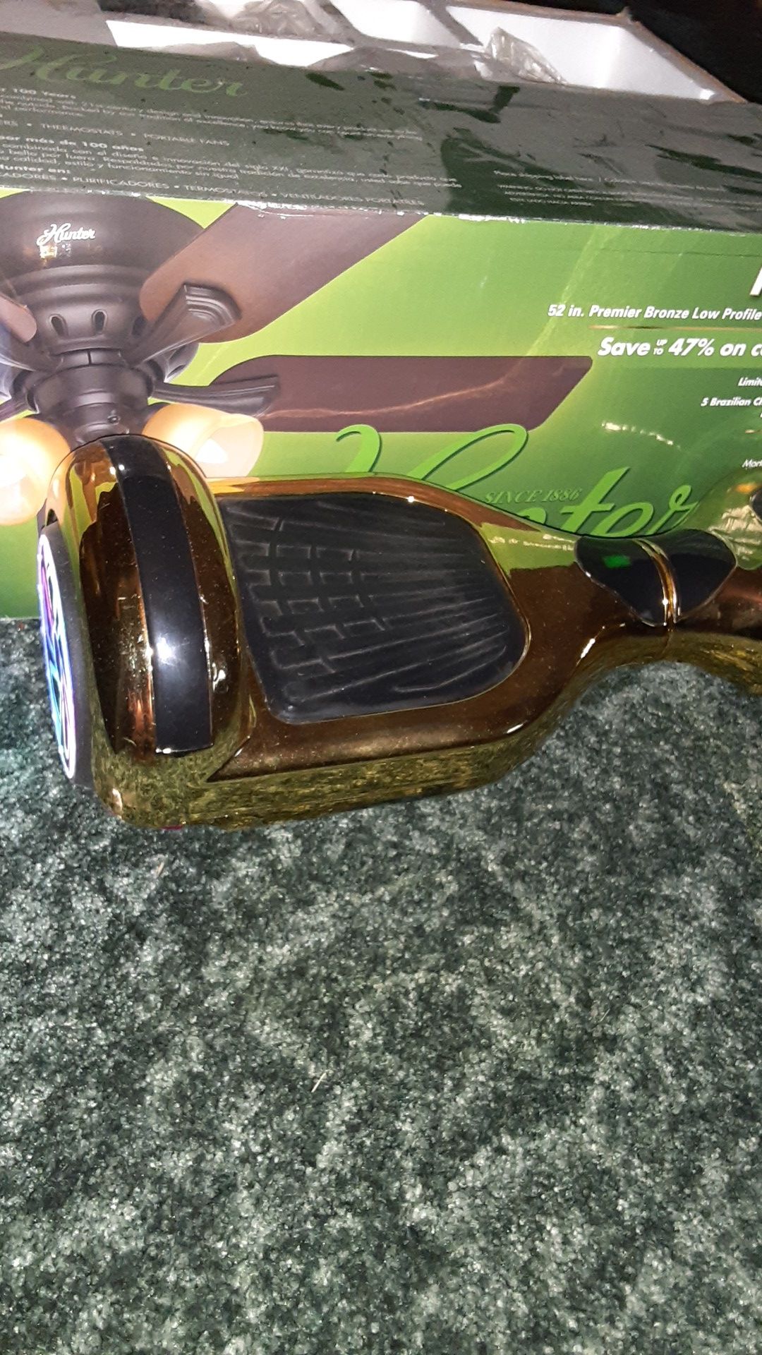 golden hoverboard with built in speakers and a charger