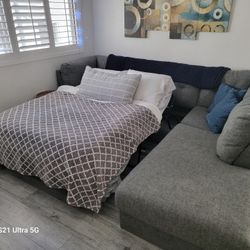 Large Sofa That Has A Full Size Bed With A Very Comfortable Materas Incudes And Pillows  