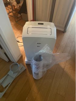 brand new LG air conditioning plug-in.