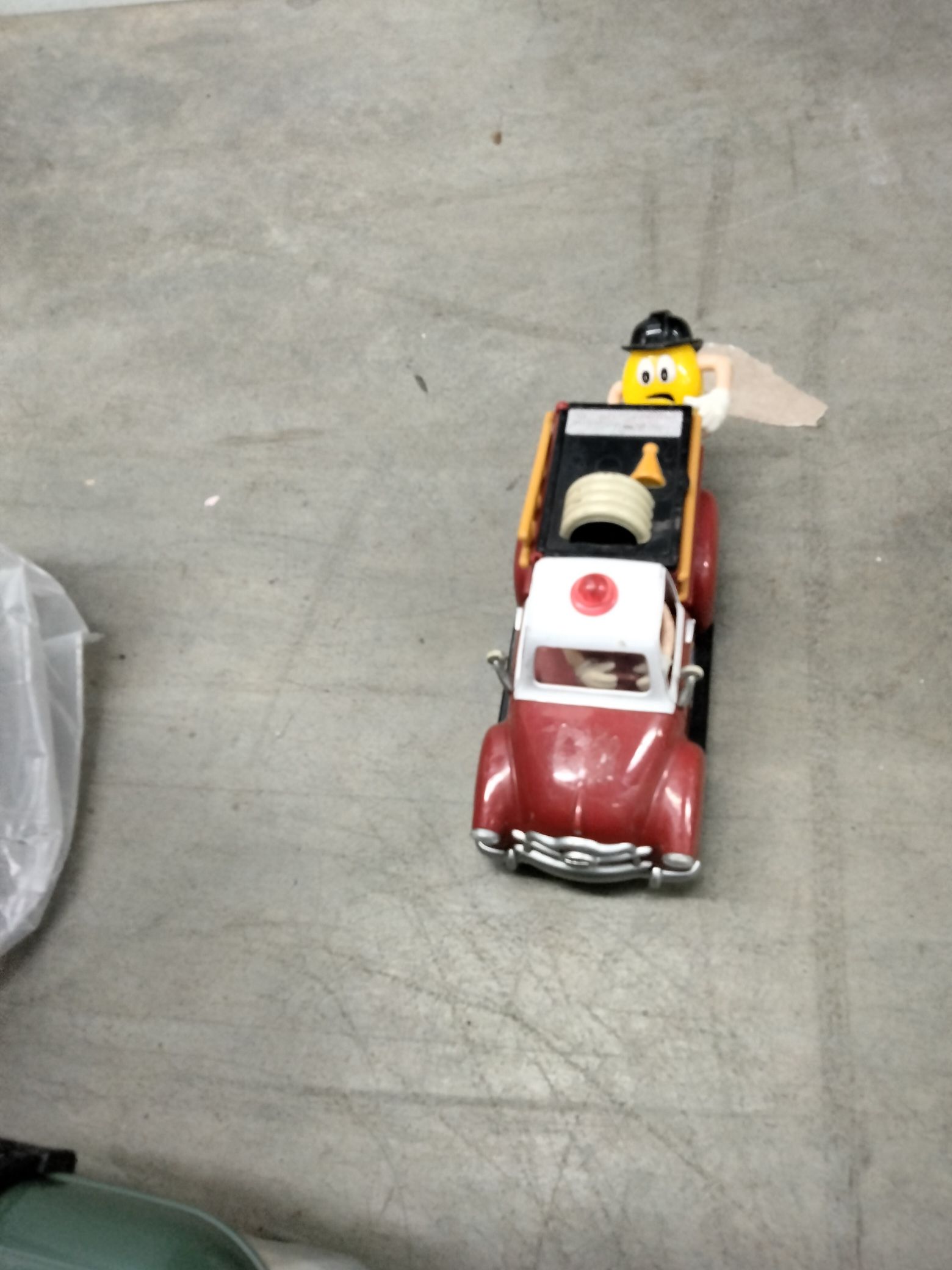 M&M Fireman On A Fire Truck Toy Truck