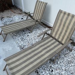 2 Beige And Tan Lounging Tan Chairs