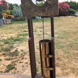 Antique Brass and Wood Water Clock with Sun Design - Unique Historical Collectible
