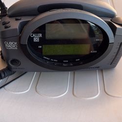 Clock telephone and radio