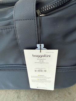 Brand new with original tags attached! The Baggallini Gramercy Carry-On Duffel combines the roominess of a duffel with the convenience of a rolling ca