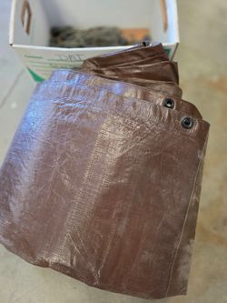 NEW 20X30 Tarp. Out of package. With NEW ball bungee tie downs.