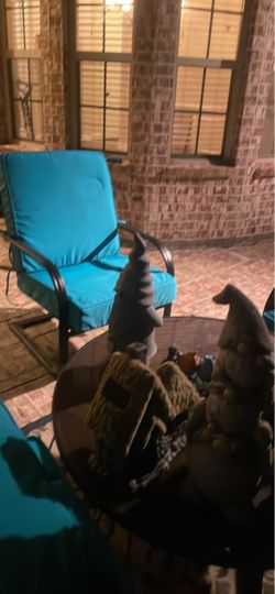 4 wrought iron chairs with new cushions and round table