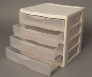 Compact white plastic storage drawer. Ideal for organizing small items. Size: 14.5" X 13.5" X 10.5".