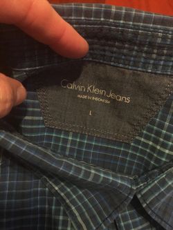 Large Calvin Klein jeans blue plaid short sleeve shirt with snap buttons