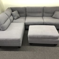 New Reversible Sectional .  Grey.  104” X 75”.  Free Delivery !