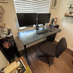Electric Standing Desk With Dual Monitors And Chair. 