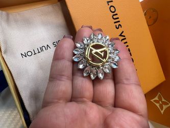 Gold-colored brooch