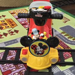 Kiddieland Disney Mickey Mouse 2-in-1 Battery-Powered Ride-On Train with Caboose and Tracks. 