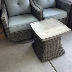 2 Swivel Wicker Chairs And Table