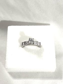 Brand new never worn .925 silver wedding ring with cubic zirconia CZ diamonds. Size 7.5