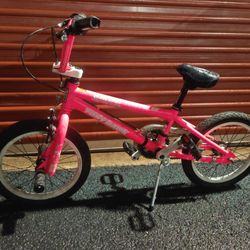 pink 16-inch Dynacraft Tony Hawk Sweet Jumps BMX bike, intended for young riders. 
