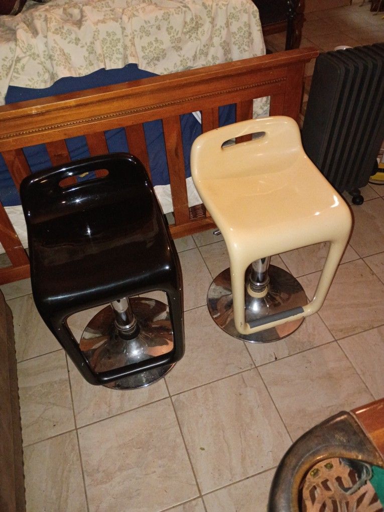 Two Artistic Swivel Fun Times Chairs