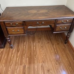 Office wooden desk with 5 draws. Pre-owned good condition.