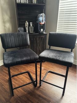 2 black bar stool chairs