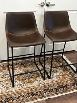 2 Brown leather chairs