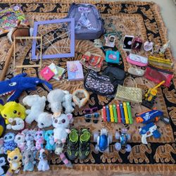 Variety of items – dolls, bags, toys, and decorations.  