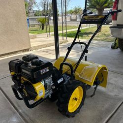 Champion Power Equipment
22in. Counter Rotating Gas Rear Tine Tiller with (not  Self-Propelled Agricultural Tires Sold exactly as shown in the photo e