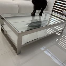 Rectangle  Coffee Table, Heavy, was $1,100. Stainless Steel Frame, Tempered Glass, Perfect Condition Size: 55W x 15H x 27.                      