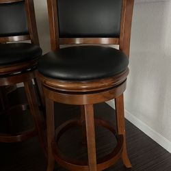 Two swivel barstools
