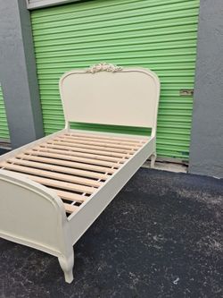 White wooden full size bed frame