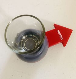 Random shot apparatus , spin and win! Includes shot glass.