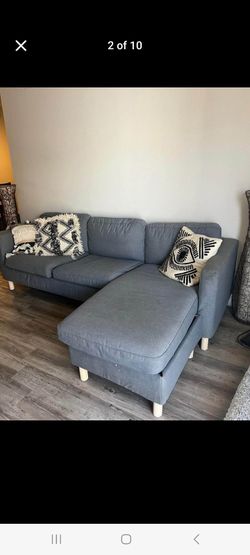 In like new condition Gray sectional free delivery