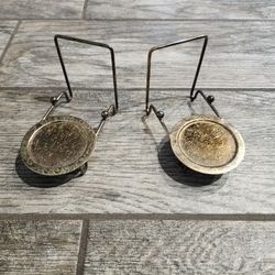 Pair of ornate tea cup and saucer display stands