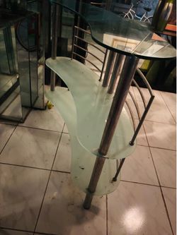 Iconic late 1970s glass home bar with a stainless steel frame