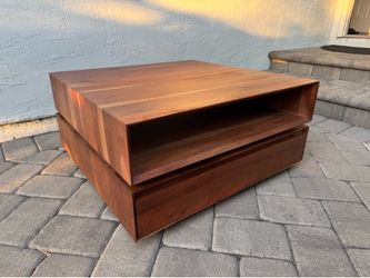 Crate and Barrel rotating coffee table with storage drawers
