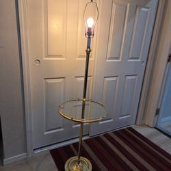 Mid-century glass and brass floor lamp.