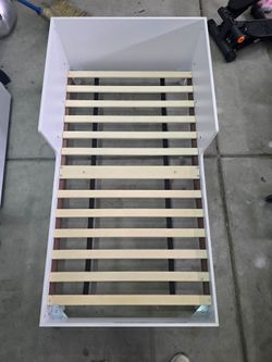 White wood toddler bed frame