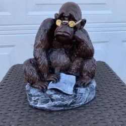 The monkey reading a newspaper statue