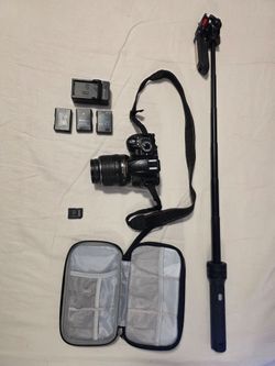 Nikon D3100 DSLR — 18-55mm lens, bag, Micro SD card adapter, charger + backpack
